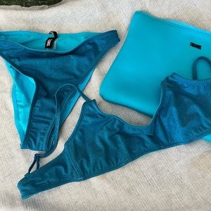 Triangle size M blue bikini. Brand new. Never worn. Comes with pouch.